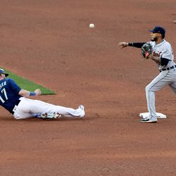 Mitch Haniger #17 of the Seattle Mariners is tagged out at second by Harold Castro #30 of the Detroit Tigers in the sixth inning