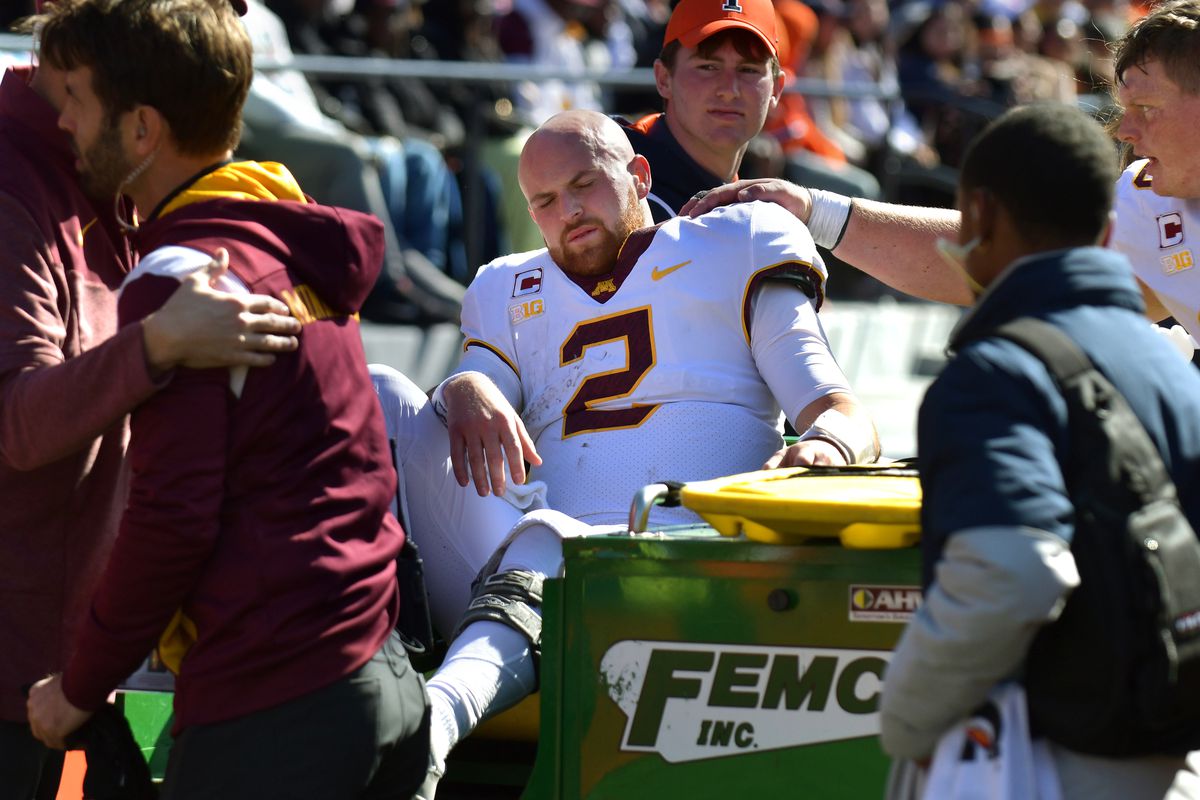 Minnesota Golden Gophers quarterback Tanner Morgan is taken off the field after an injury during the second half against the Illinois Fighting Illini at Memorial Stadium.