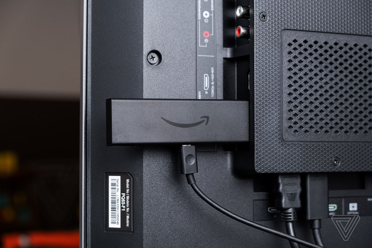Amazon’s Fire TV Stick 4K, the best inexpensive alternative to Roku, pictured attached to a TV’s HDMI port.