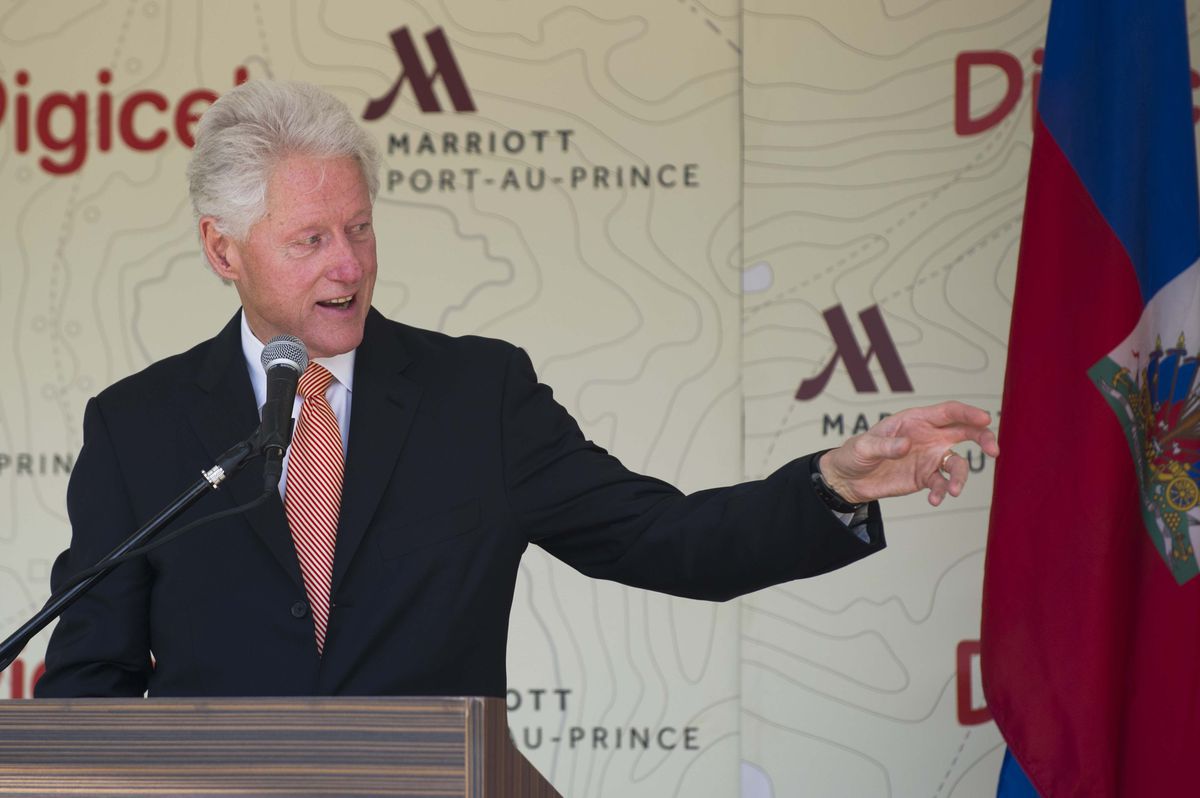 Bill Clinton speaks at the opening ceremony of the Marriott Port-Au-Prince, Haiti