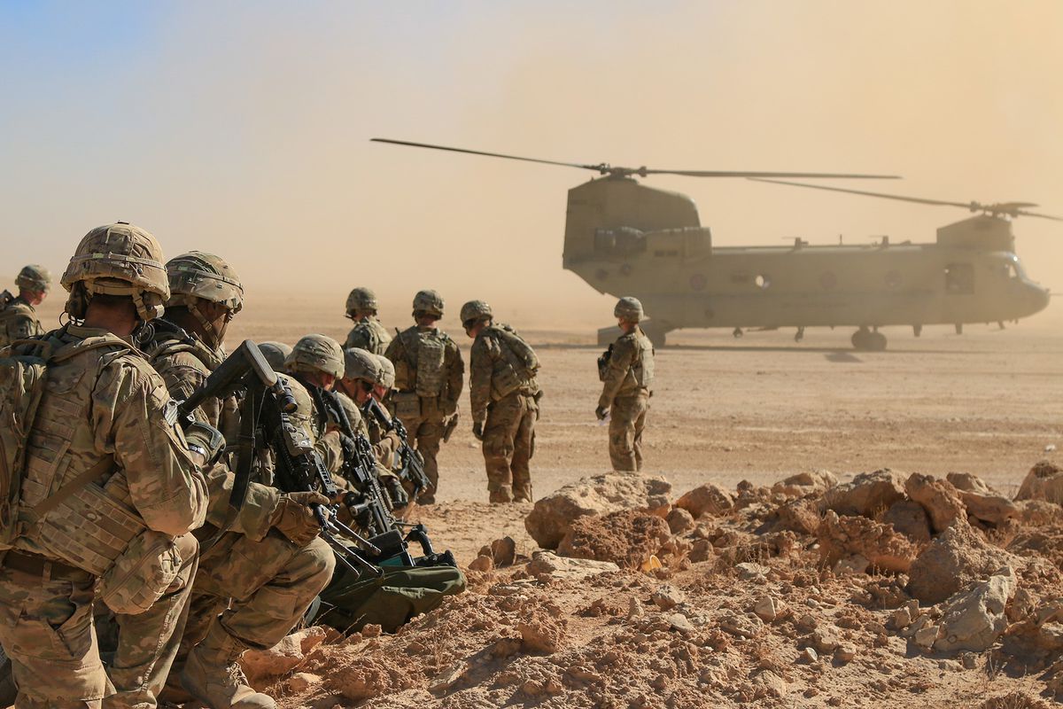 Soldiers assigned to the 1st Squadron, 3rd Cavalry Regiment, await extraction via a CH-47 Chinook during an aerial response force live-fire training exercise, Al Asad Air Base, Iraq, Oct. 31, 2018.