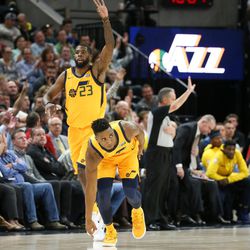Utah Jazz forward Royce O'Neale (23) and guard Donovan Mitchell (45) celebrate after Mitchell scored three against the Denver Nuggets at Vivint Smart Home Arena in Salt Lake City on Tuesday, Nov. 28, 2017.