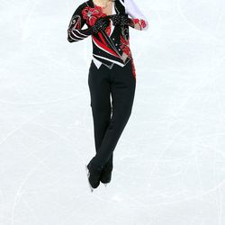 <b>Misha Ge of Uzbekistan</b> successfully matched his hair to his free skate costume. And that was just about the only successful part of this busy getup.