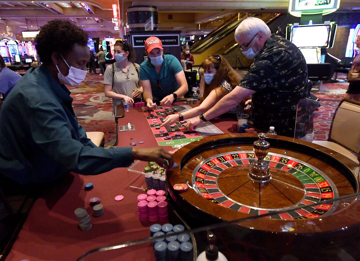 Guests play roulette at Excalibur Hotel &amp; Casino after the Las Vegas Strip upon reopening from the coronavirus shutdown June 11.