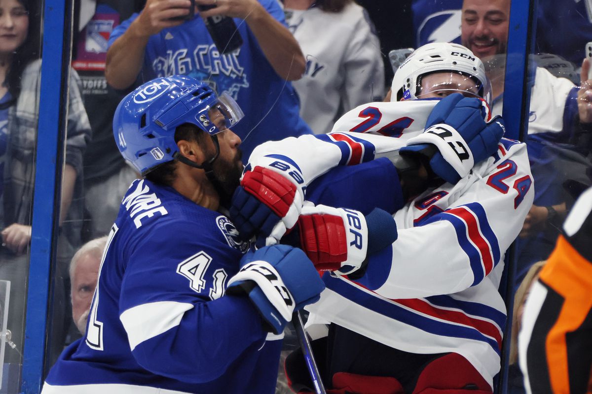Pierre-Edouard Bellemare #41 of the Tampa Bay Lightning pushes Kaapo Kakko #24 of the New York Rangers in Game Four of the Eastern Conference Final during the 2022 Stanley Cup Playoffs at Amalie Arena on June 07, 2022 in Tampa, Florida.