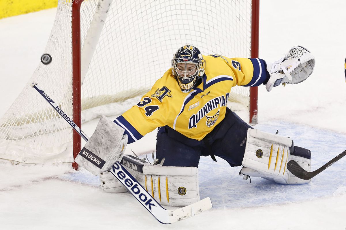Quinnipiac goaltender Michael Garteig makes a save against the University of Maine during a game in the 2013-14 season.