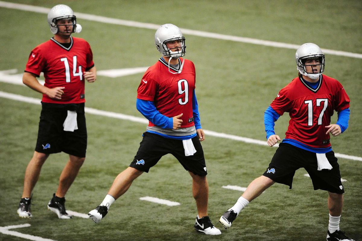 May 29, 2012; Allen Park, MI, USA; Detroit Lions quarterbacks Shaun Hill (14),  Matthew Stafford (9) and Kellen Moore (17) stretch during organized team activities at Lions training facility. Mandatory Credit: Andrew Weber-US PRESSWIRE