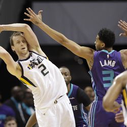Utah Jazz's Joe Ingles (2) looks to pass as Charlotte Hornets' Jeremy Lamb (3) defends during the second half of an NBA basketball game in Charlotte, N.C., Friday, Jan. 12, 2018. (AP Photo/Chuck Burton)