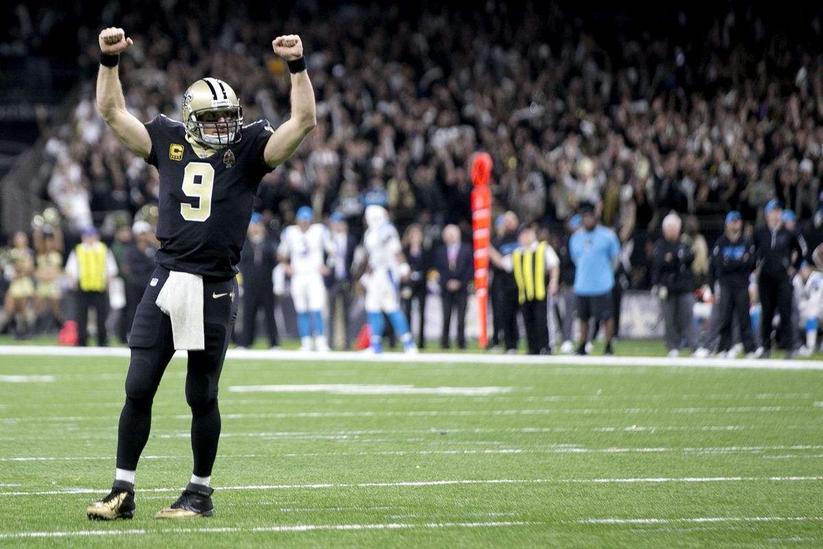 NEW ORLEANS, LA:  New Orleans Saints quarterback Drew Brees (9) celebrates after scoring a touchdown pass during the NFC Wild Card playoff game against the Carolina Panthers at the Mercedes-Benz Superdome.