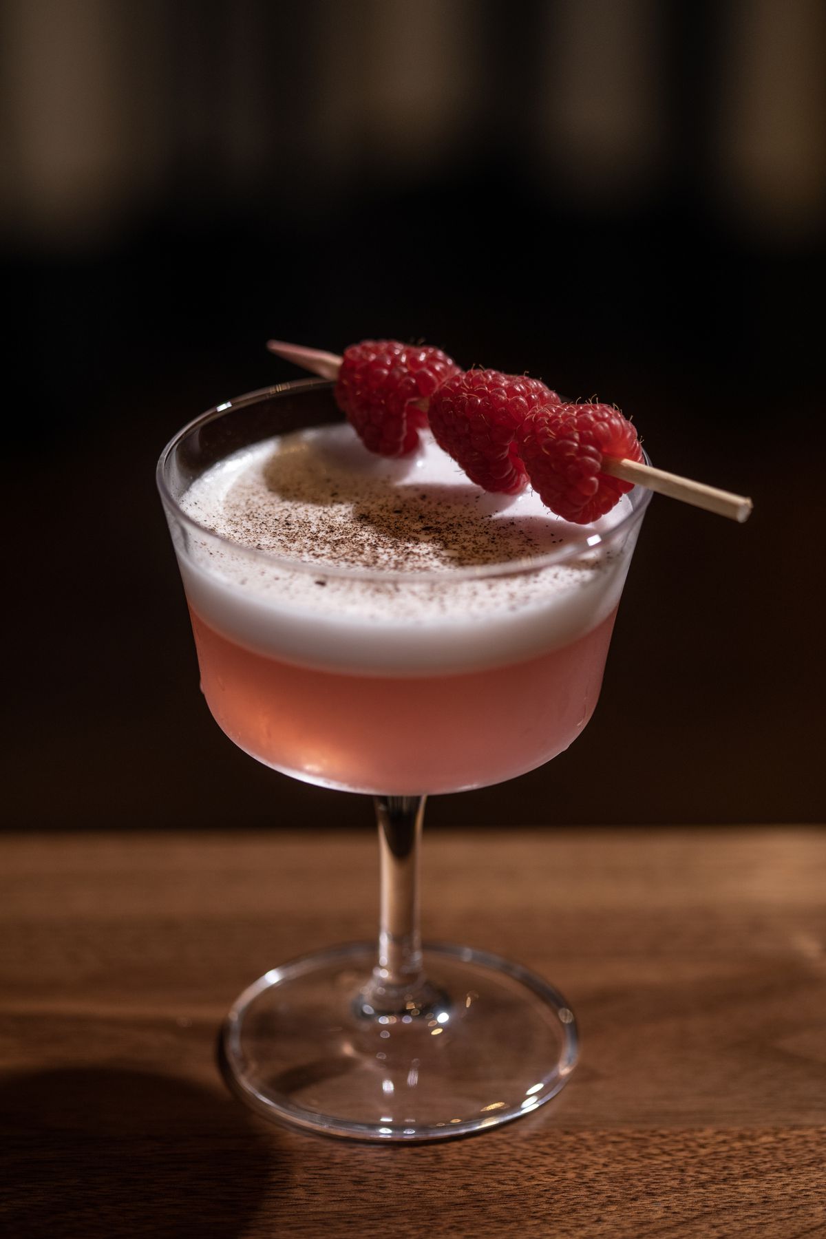 The Little R&amp;R at Foundation Social Eatery in Alpharetta, GA, features a rosy pink hue from London dry gin, raspberry syrup, rosemary, dry vermouth, and lemon loomy (dried limes).