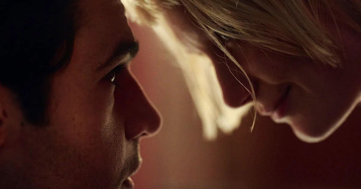 (L-R) Close-up shot of Christopher Abbott and Mia Wasikowska staring at each other in Piercing.