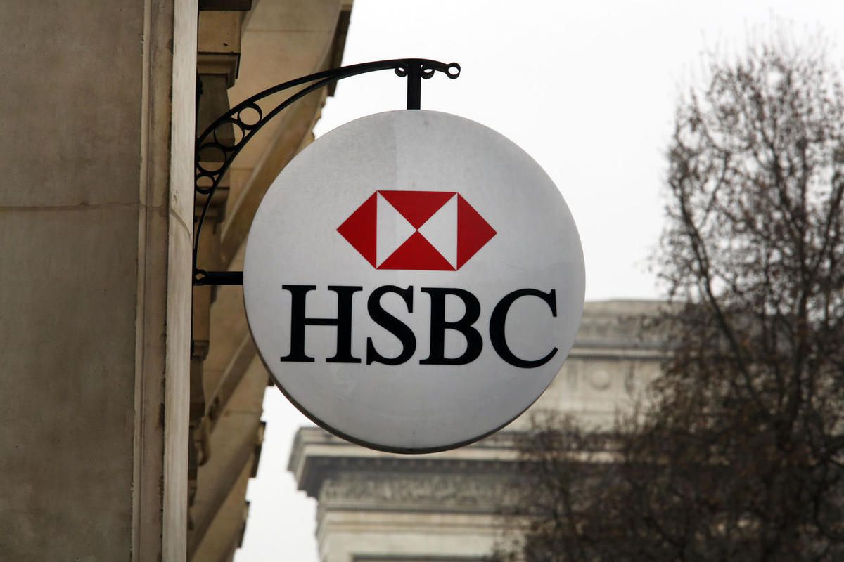 The logo of British bank HSBC is visible on the facade of HSBC France headquarters on the Champs Elysees in Paris, Monday Feb. 9, 2015. French prime minister Manuel Valls reacted Monday after details of some 30,000 accounts with $120 billion of assets wer
