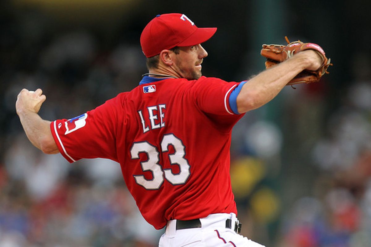 ARLINGTON TX - JULY 22:  Pitcher Cliff Lee #33 of the Texas Rangers throws against the Los Angeles Angels of Anaheim on July 22 2010 at Rangers Ballpark in Arlington Texas.  (Photo by Ronald Martinez/Getty Images)