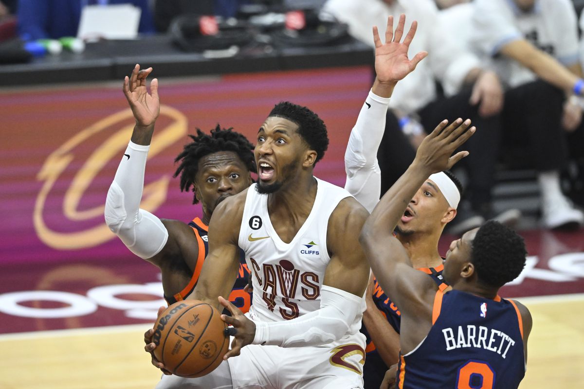 Cleveland Cavaliers guard Donovan Mitchell (45) drives through a trio of New York Knicks defenders in the second quarter of game one of the 2023 NBA playoffs at Rocket Mortgage FieldHouse.&nbsp;