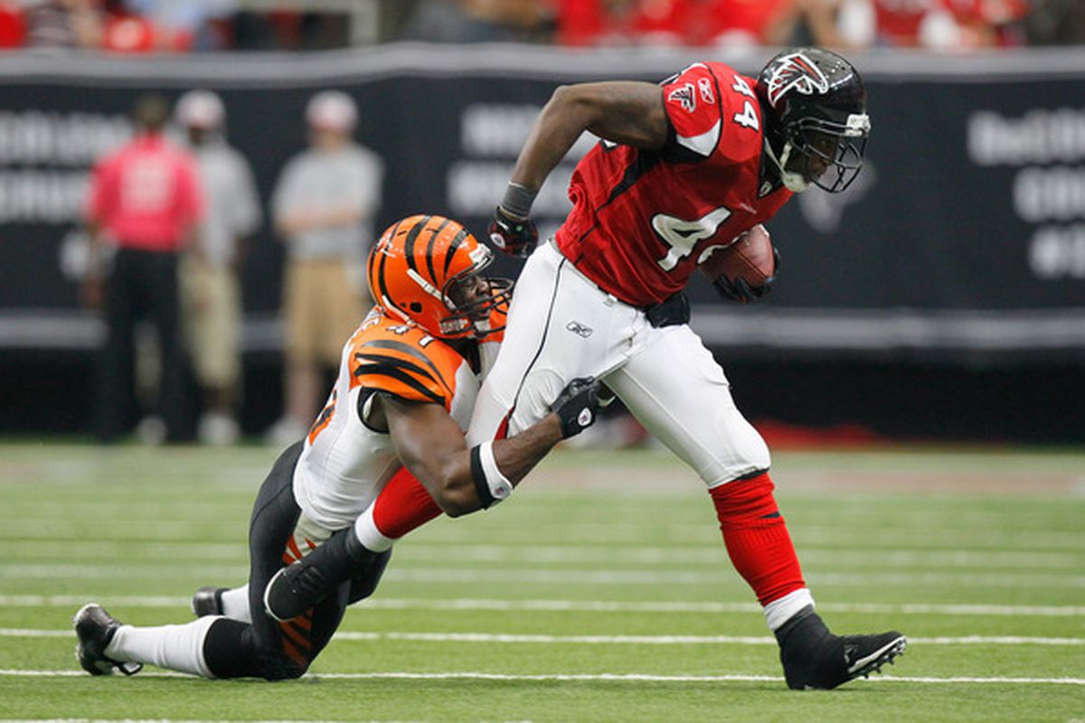 ATLANTA - OCTOBER 24:  Jason Snelling #44 of the Atlanta Falcons is tackled by Chinedum Ndukwe #41 of the Cincinnati Bengals at Georgia Dome on October 24 2010 in Atlanta Georgia.  (Photo by Kevin C. Cox/Getty Images)
