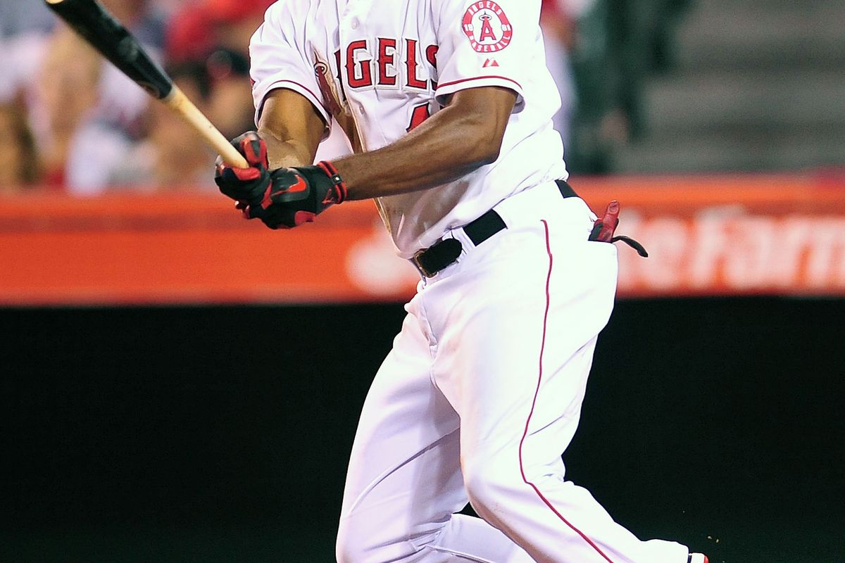 July 28, 2012; Anaheim, CA, USA; Los Angeles Angels right fielder Torii Hunter (48) hits a single in the eighth inning against the Tampa Bay Rays at Angel Stadium. Mandatory Credit: Gary A. Vasquez-US PRESSWIRE