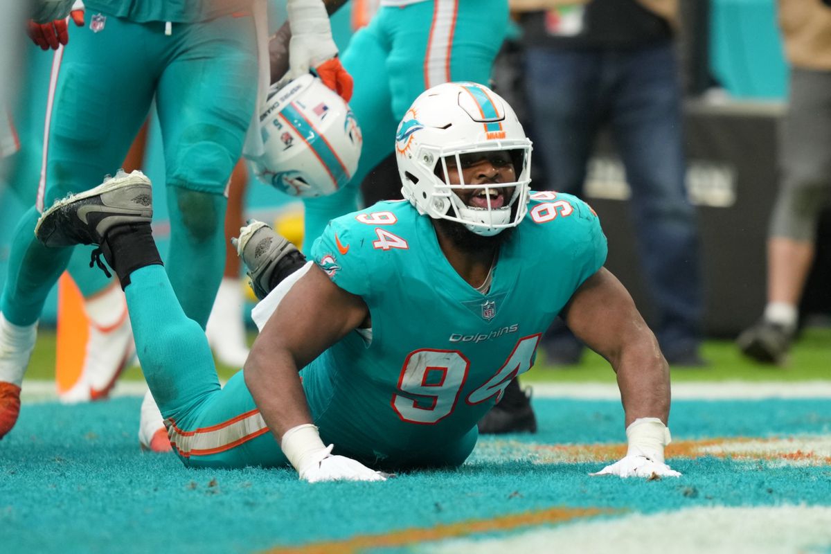 Miami Dolphins defensive end Christian Wilkins (94) celebrates his touchdown against the New York Jets by doing the worm dance move in the endzone during the second half at Hard Rock Stadium