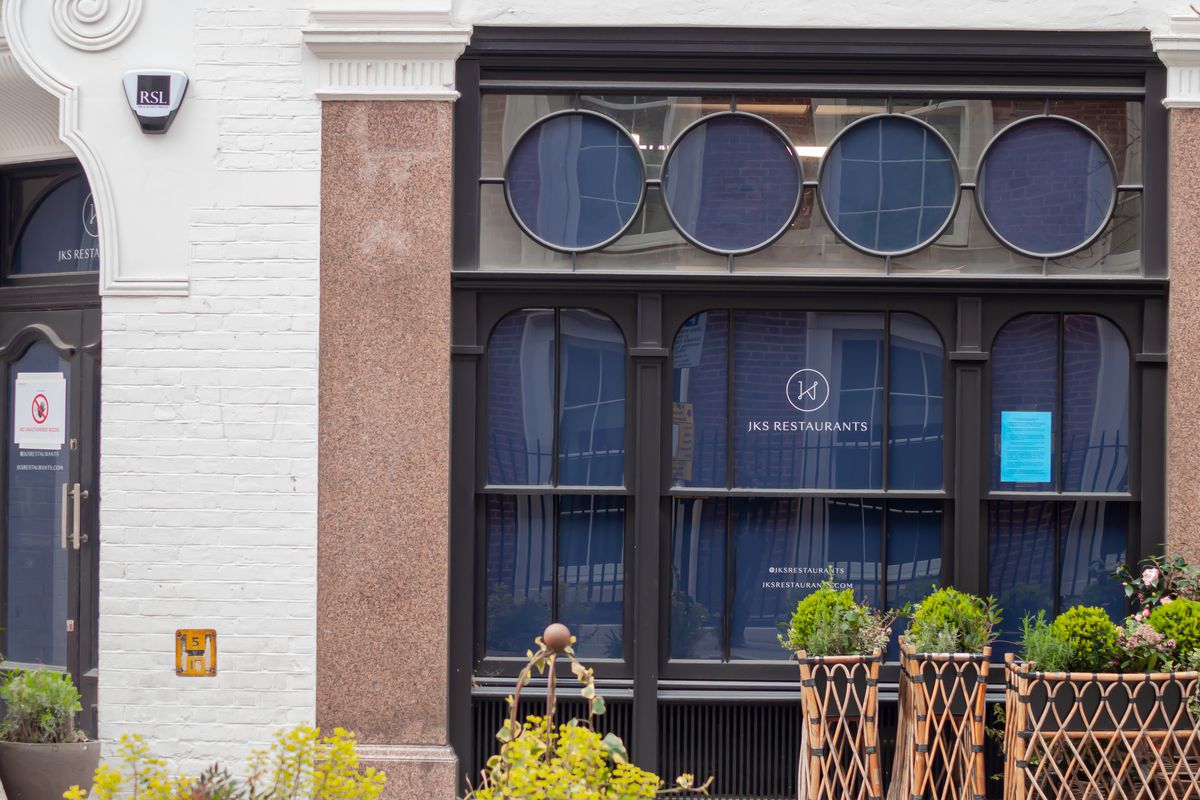 “JKS Restaurants” signage in the windows of a new restaurant at 42 North Audley Street in Mayfair