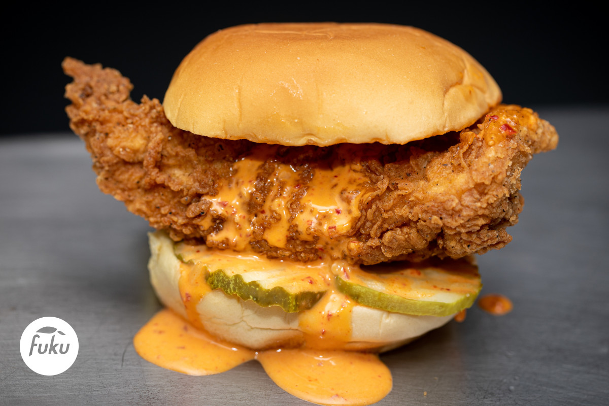 The Fuku sandwich includes a 6-ounce chicken breast cutlet brined in habanero chile puree with pickles, and a spicy Fuku mayo on a Martin’s potato roll.