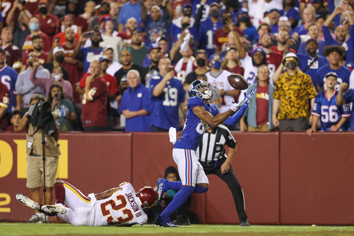 Darius Slayton #86 of the New York Giants makes a reception for a touchdown ahead of William Jackson #23 of the Washington Football Team during the third quarter at FedExField on September 16, 2021 in Landover, Maryland.