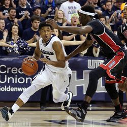 Julion Pearre (5) of Utah State drives against Goodluck Okonoboh (11) of UNLV during NCAA basketball in Logan Tuesday, Feb. 24, 2015.

