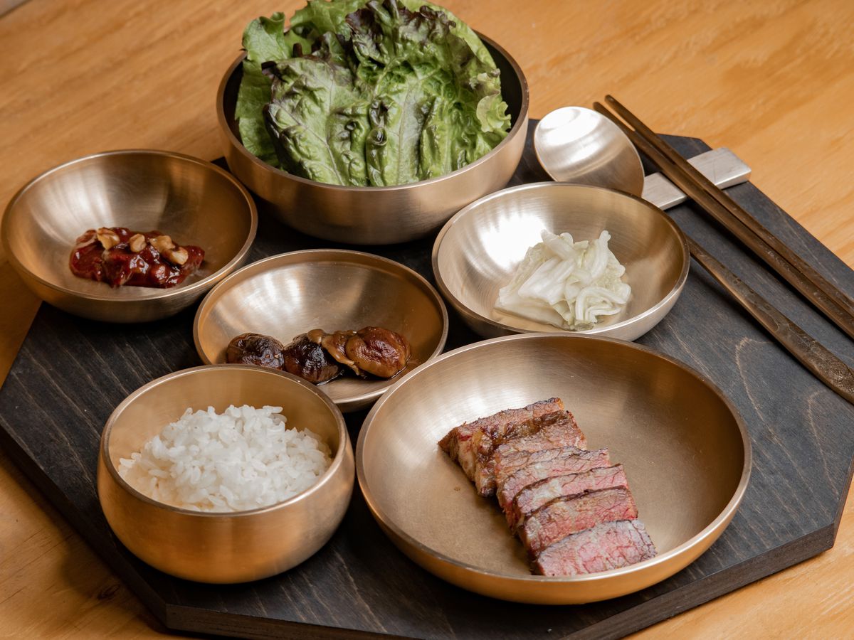 Dishes of braised beef short rib, walnut ssamjang, rice, and lettuce leaves, from Suragan, a new restaurant in San Francisco.