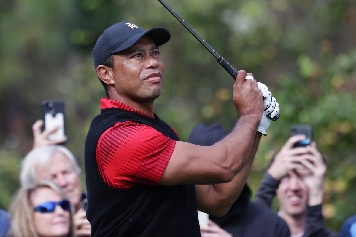 Tiger Woods watches his drive on the third hole during the final round of the PNC Championship golf tournament at Ritz Carlton Golf Club Grande Lakes Orlando Course.