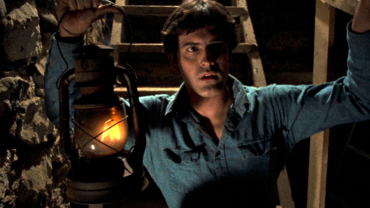 Ash Williams with a lantern in Evil Dead