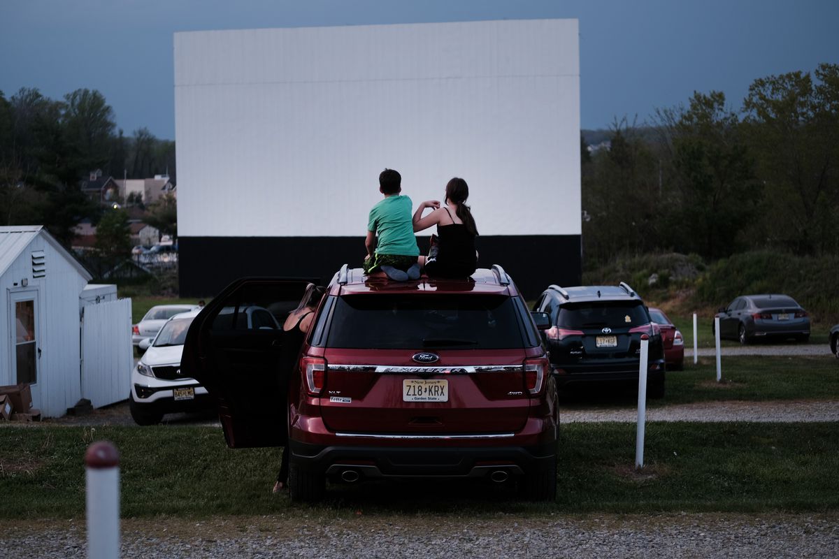 Families enjoy a movie at the Warwick Drive-In on the first evening that the theater was allowed to re-open on May 15, 2020 in Warwick, New York.&nbsp;