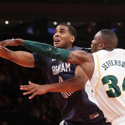 BYU forward Brandon Davies (0) shoots by Baylor Bears forward Cory Jefferson (34) during the NIT Final Four in New York City Tuesday, April 2, 2013. BYU lost 76-70.