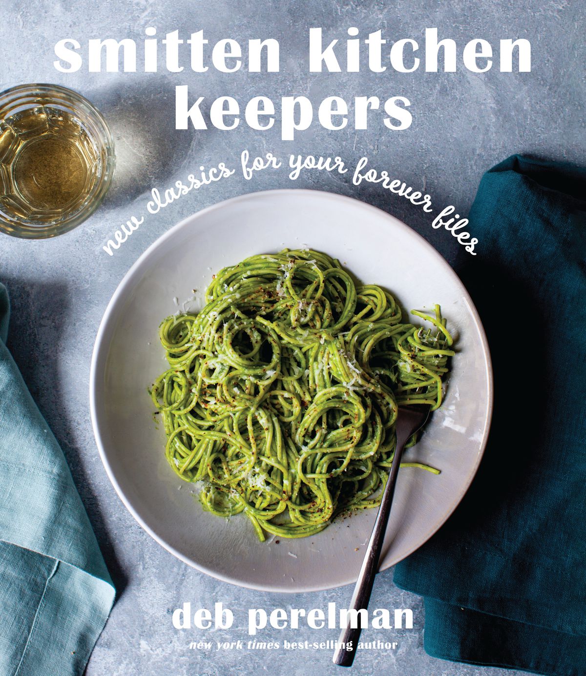 The cover of Smitten Kitchen Keepers featuring a bowl of green pasta
