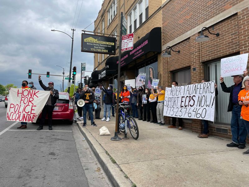 Community groups protest outside Ald. Chris Taliaferro’s Austin office, pushing for a vote on the proposed Empowering Communities for Public Safety Ordinance.