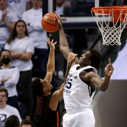 Brigham Young Cougars forward Fousseyni Traore (45) blocks Pacific Tigers guard Jaden Byers (11) at the basket as BYU and Pacific play in an NCAA basketball game in Provo at the Marriott Center on Thursday, Jan. 6, 2022. BYU won 73-51.