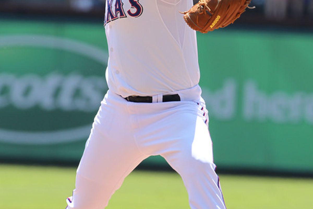 Apr 6, 2012; Arlington, TX, USA; Texas Rangers starting pitcher Colby Lewis (48) pitches against the Chicago White Sox during opening day at Rangers Ballpark. during a workout at Rangers Ballpark. Mandatory Credit: Matthew Emmons-US PRESSWIRE