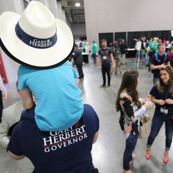 Attendees walk during the Utah State Republican Convention at the Salt Palace in Salt Lake City on Saturday, April 23, 2016.