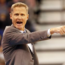 Golden State Warriors head coach Steve Kerr calls out a play in overtime of an NBA regular season game against the Utah Jazz at the Vivint Arena in Salt Lake City, Wednesday, March 30, 2016.