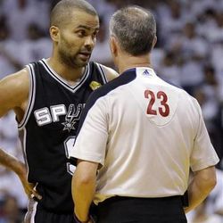 San Antonio Spurs guard Tony Parker (9) talks to official Jason Phillips (23) during the second half of Game 1 of the NBA Finals basketball game against the Miami Heat, Thursday, June 6, 2013 in Miami. (AP Photo/Lynne Sladky)