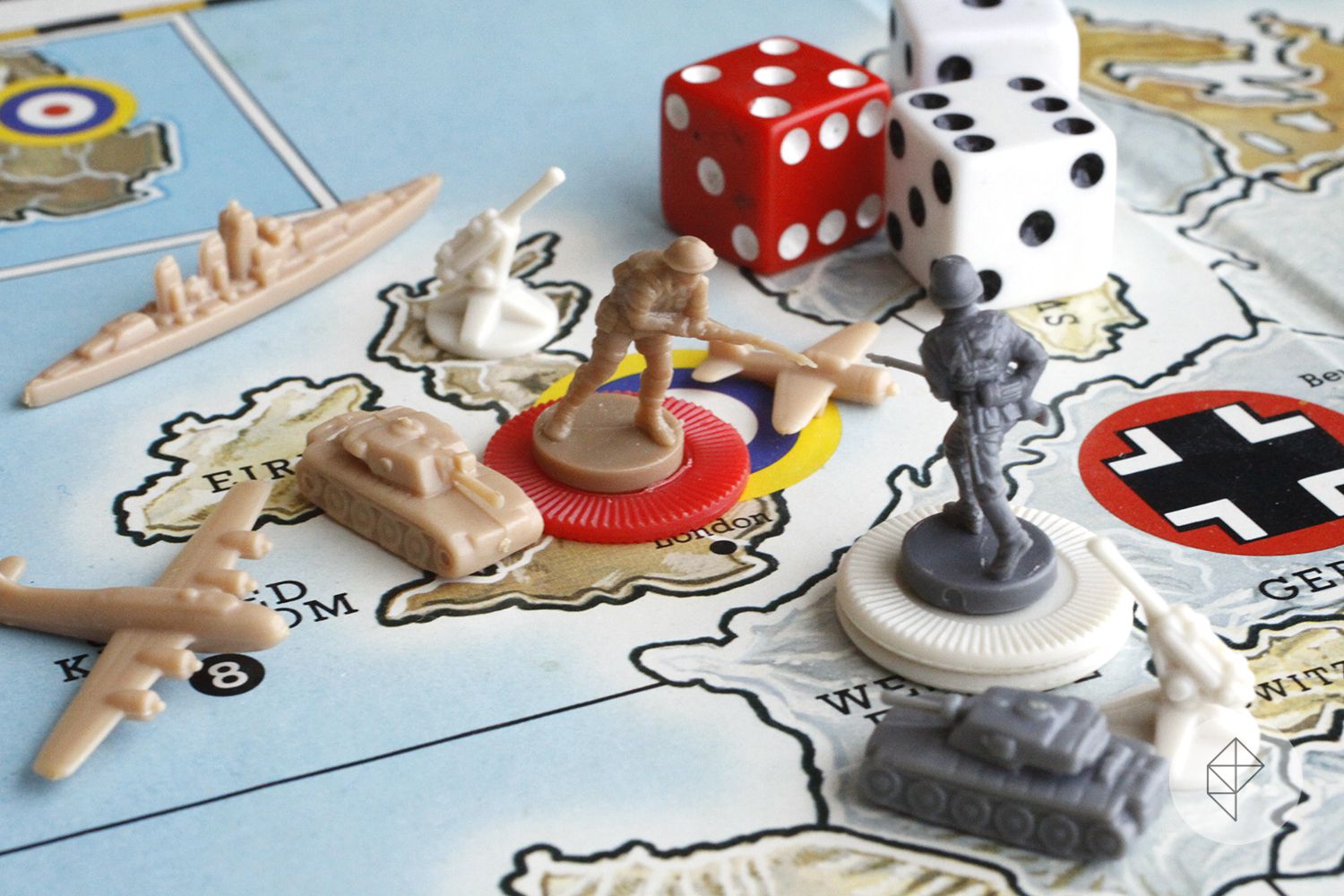 Photo of Axis &amp; Allies board showing infantry, air, and sea units across the English Channel. There are dice in the background as well.