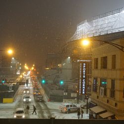 View looking west on Addison Street, toward Wrigley Field, from the CTA Red Line train station platform. Note that the ballpark lights are on
