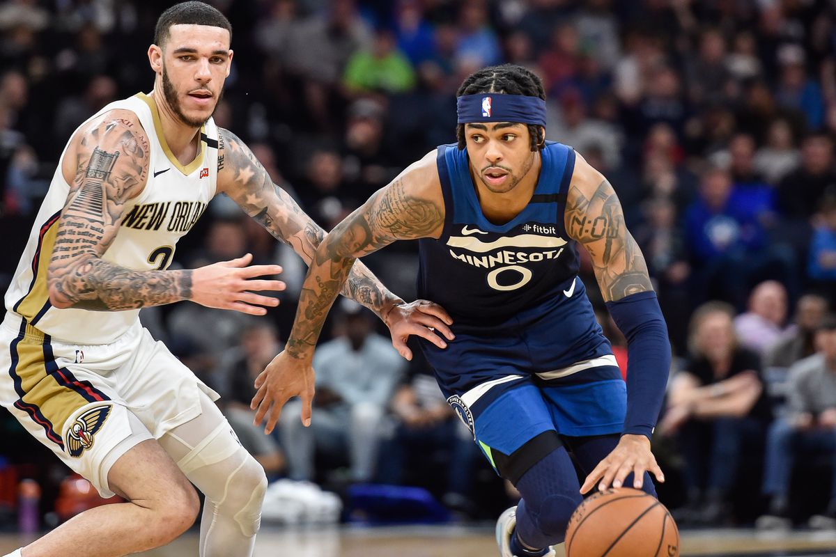 Minnesota Timberwolves guard D’Angelo Russell controls the ball as New Orleans Pelicans guard Lonzo Ball looks on during the second half at Target Center.&nbsp;