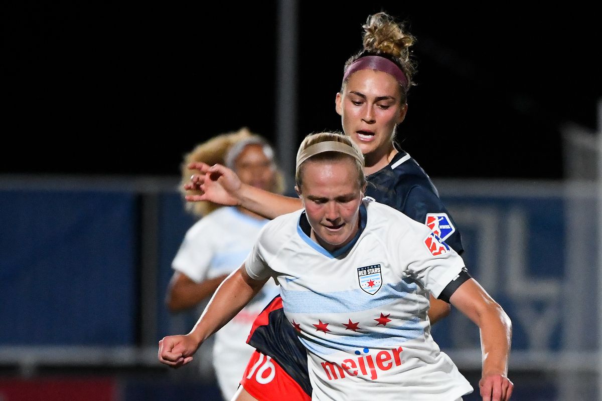 Zoe Morse #14 of the Chicago Red Stars drives past Averie Collins #16 of the Washington Spirit in the first round of the NWSL Challenge Cup at Zions Bank Stadium on June 27, 2020 in Herriman, Utah.