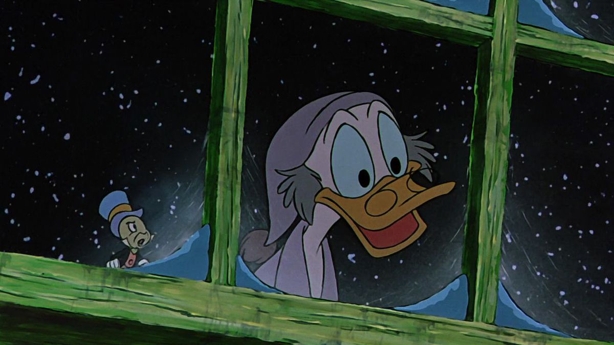 Scrooge McDuck dressed as Ebenezer Scrooge looks through a frosted window with Jiminy Cricket in Mickey's Christmas Carol.