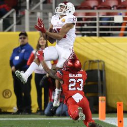 Utah Utes defensive back Julian Blackmon (23) interferes with Indiana Hoosiers wide receiver Nick Westbrook (15) as he scores a touchdown as the Utes and the Hoosiers play in the Foster Farms Bowl in Santa Clara, California on Wednesday, Dec. 28, 2016.