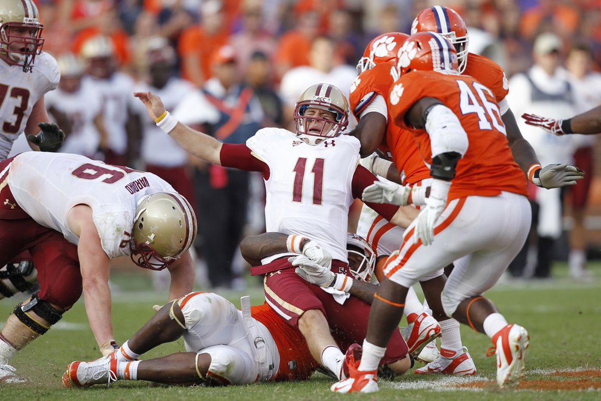Chase Rettig #11 of the Boston College Eagles grimaces in pain after being hit by Andre Branch #40 of the Clemson Tigers at Memorial Stadium on October 8, 2011 in Clemson, South Carolina. Clemson won 36-14. (Photo by Joe Robbins/Getty Images)