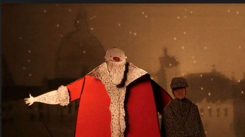 Scrooge is visited by the Ghost of Christmas Present in Manual Cinema’s livestreamed production of “A Christmas Carol.”