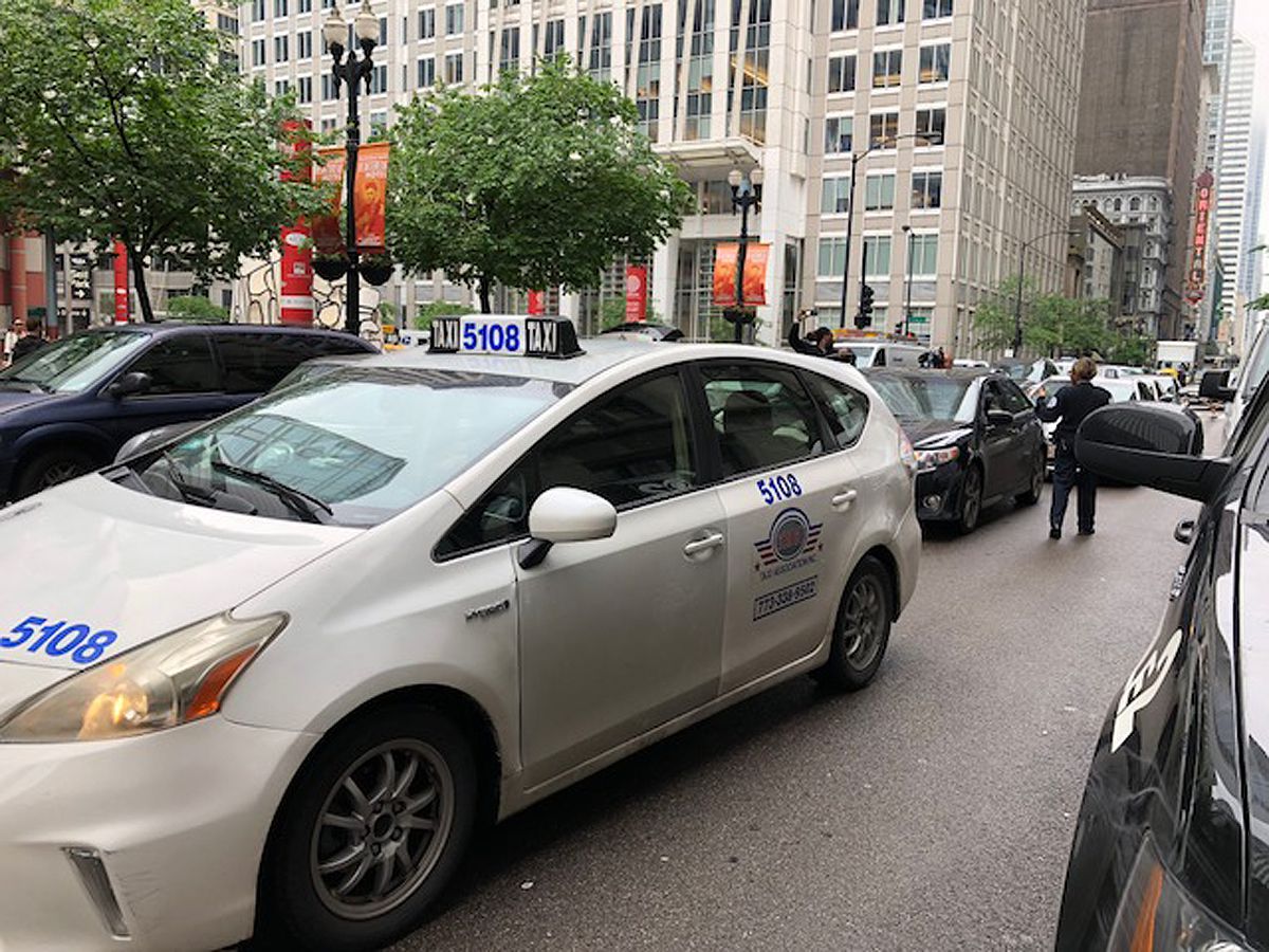Protesters seeking an elected school board and rent control blocked traffic briefly on Monday in the Loop. | Fran Spielman/Sun-Times