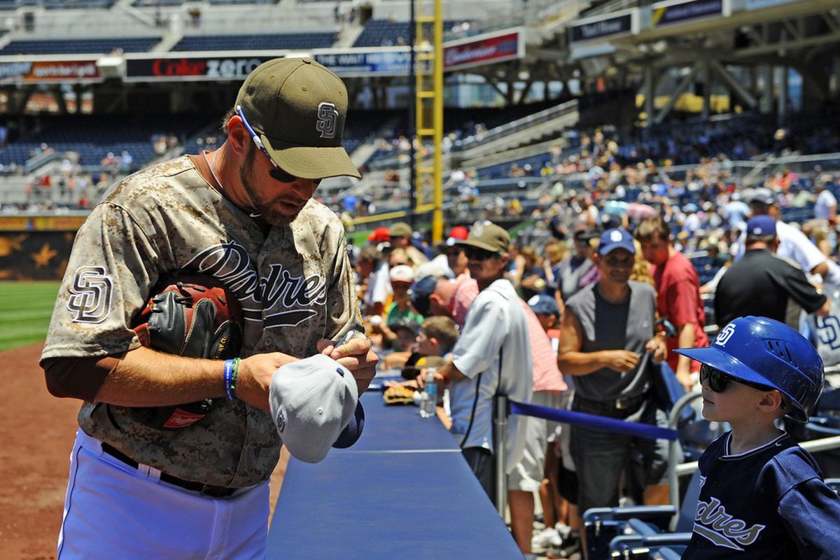Mark Kotsay sheepishly requests an autograph from a little boy 