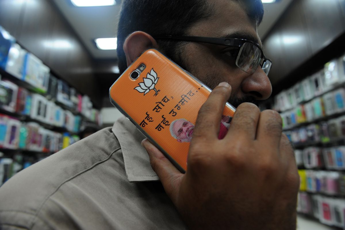 A phone adorned with BJP symbols and Narendra Modi's face.