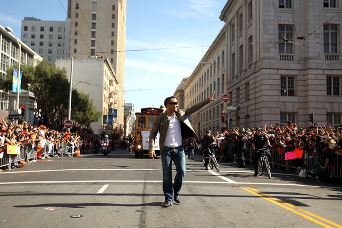 Andres Torres of the San Francisco Giants walks down the street during the San Francisco Giants victory parade.