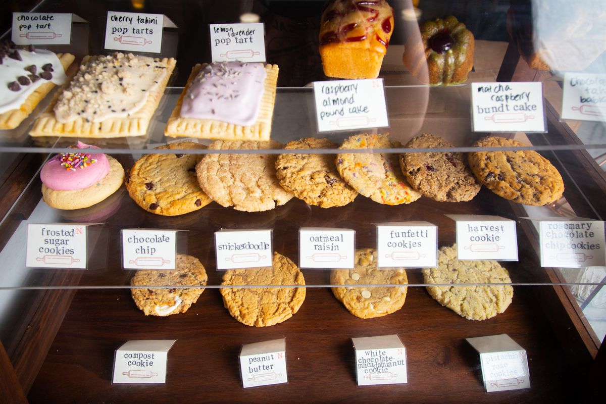 cookies and pop tarts in a glass pastry case at crust vegan bakery